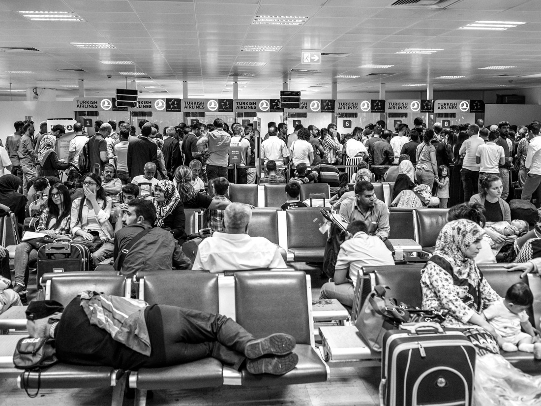 Passengers wait for their delayed flights.