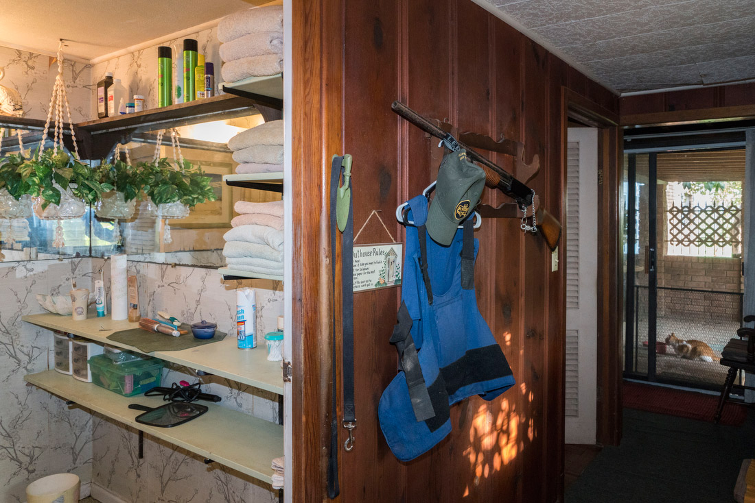 A Border Patrol vest and rifle hang from a hook in the home of Pamela Taylor, an 88-year-old English-American woman who married a Mexican-American man from Brownsville she met during World War II and moved to the US shortly afterwards.