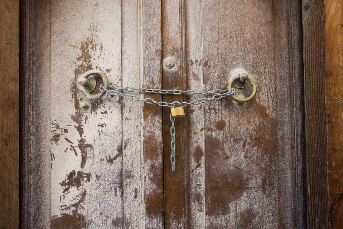 A chained door in the “zona rossa,” or red zone.