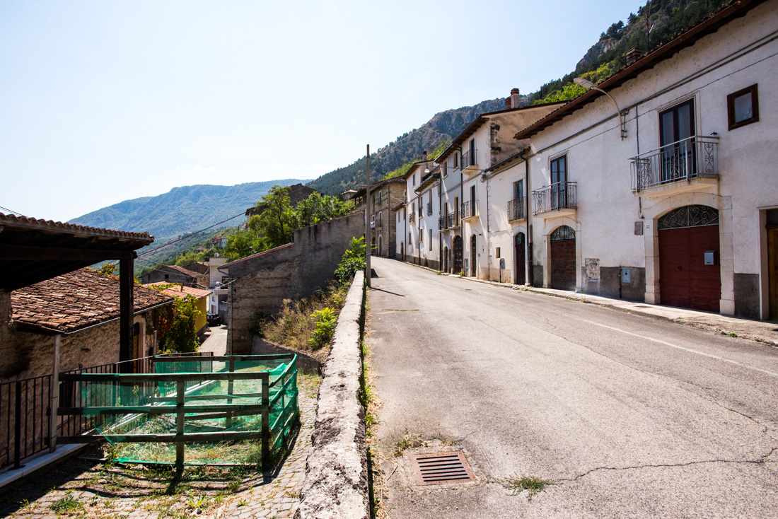 A view of Fossa’s main street, where buildings are shuttered and abandoned.