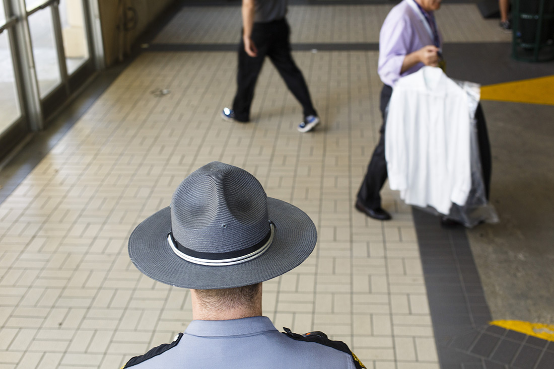 A security officer guards the entrance to a parking garage where members of the media were working at the Republican convention.