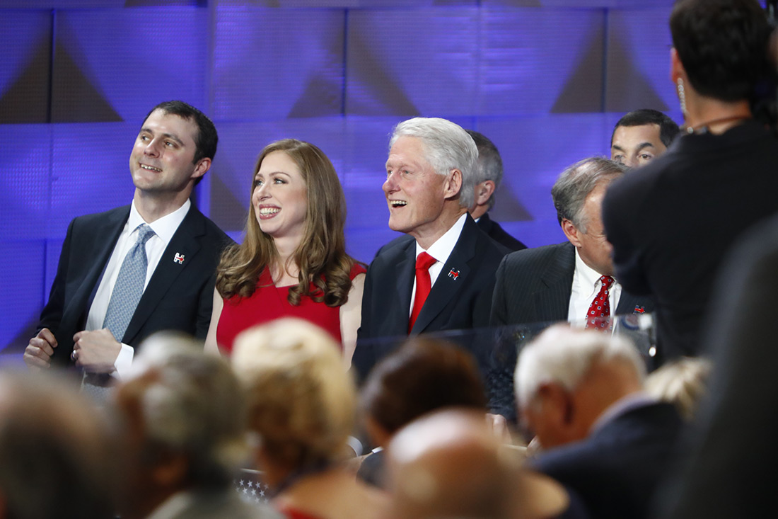 Clinton’s family watches her speech.