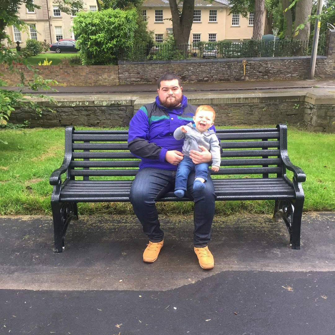 people sitting on a park bench