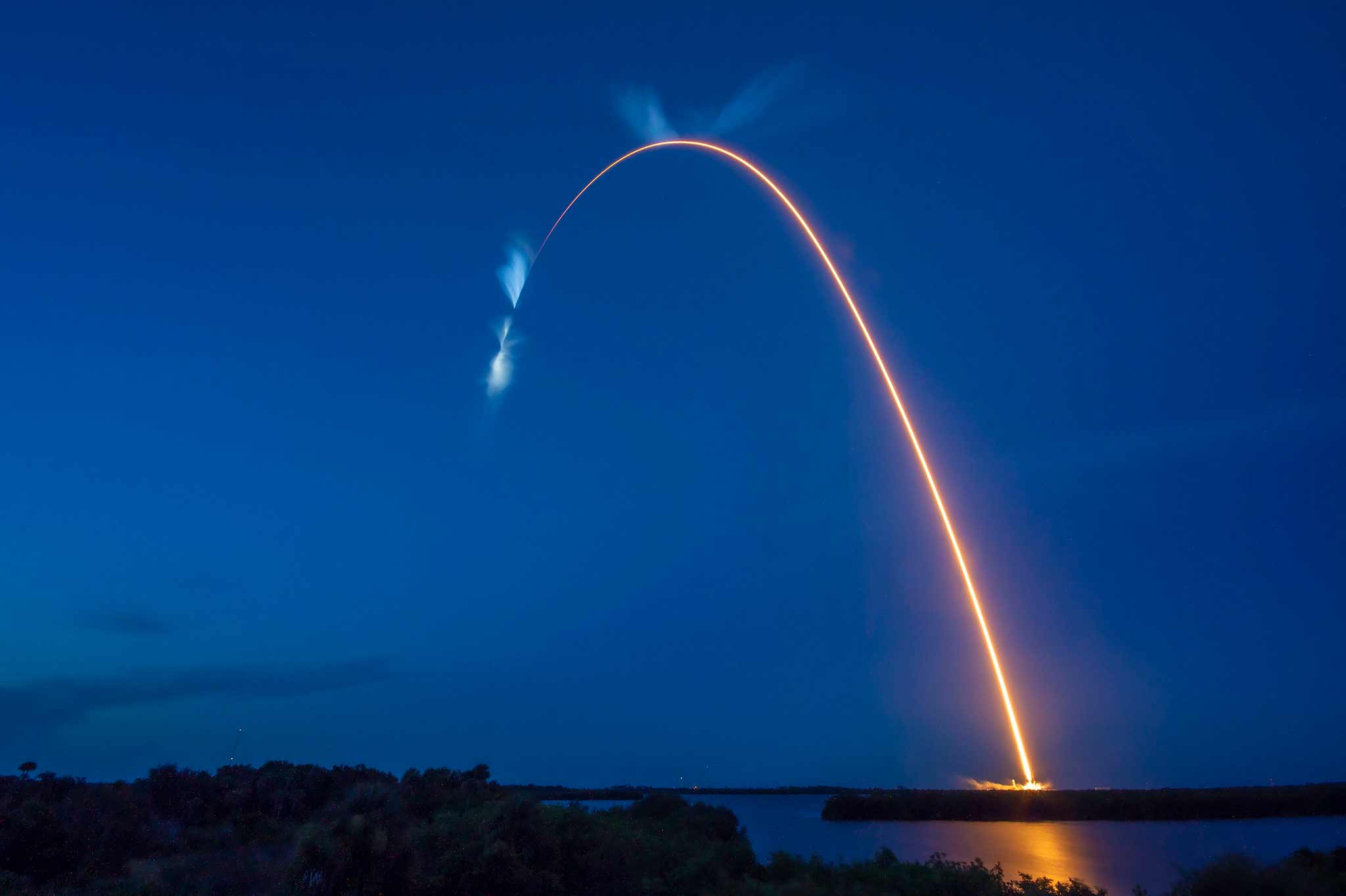 A bright trail of light is seen in this long-exposure photograph taken after the SpaceX Falcon 9 rocket, which carried the Dragon cargo spacecraft to the International Space Station, lifted off from Kennedy Space Center in Florida on July 14.