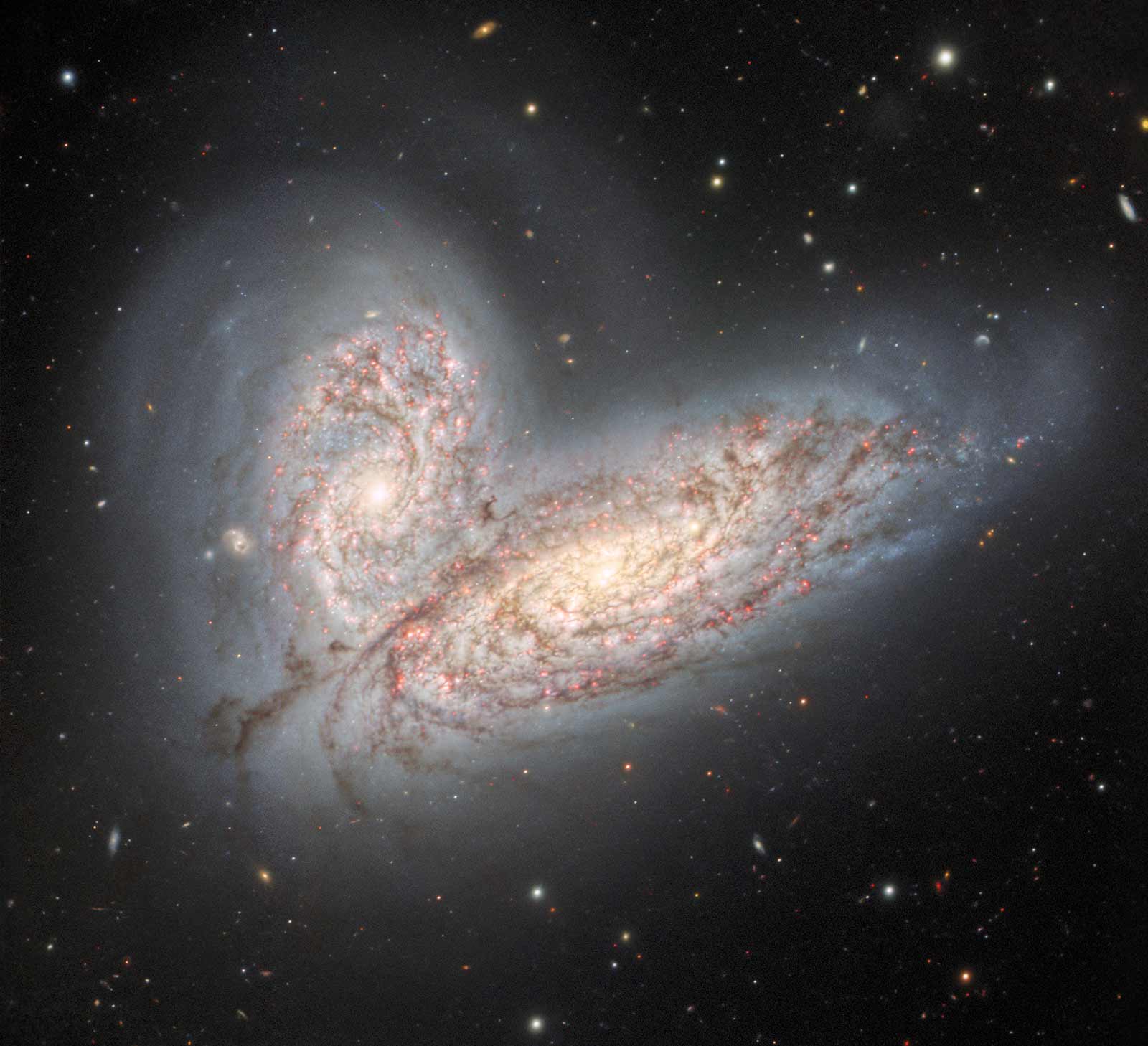 In this image released on August 9, the Gemini North telescope captured a pair of galaxies, NGC 4567 (top) and NGC 4568 (bottom), as they collide. Nicknamed the <a href="https://www.cnn.com/2022/08/10/world/colliding-galaxies-gemini-north-image-scn/index.html" target="_blank">Butterfly galaxies</a>, they will eventually merge as a single galaxy in 500 million years.