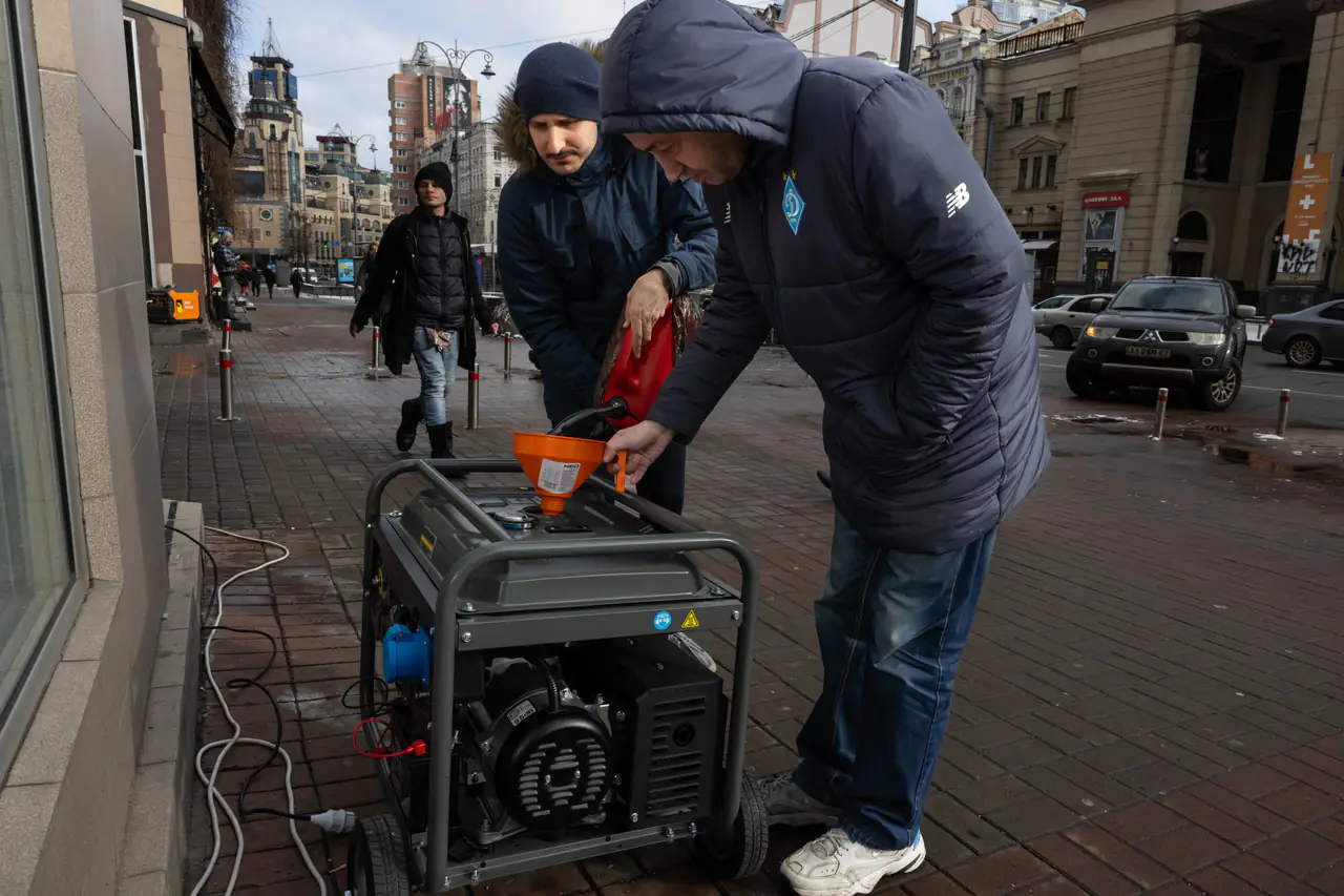 Shopkeepers start up their generators as a power outage begins in downtown Kyiv.