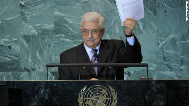 Mahmoud Abbas holds a copy of the letter requesting Palestinian statehood as he speaks at the U.N. on September 23, 2011.