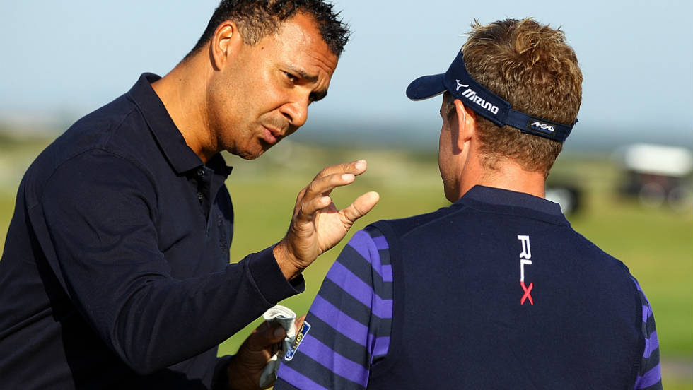 Dutch football legend Ruud Gullit in discussion with world number one Luke Donald.