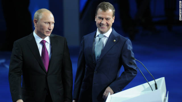 Dmitry Medvedev (R) and Vladimir Putin make a joint appearance at a congress of the United Russia party on September 24.