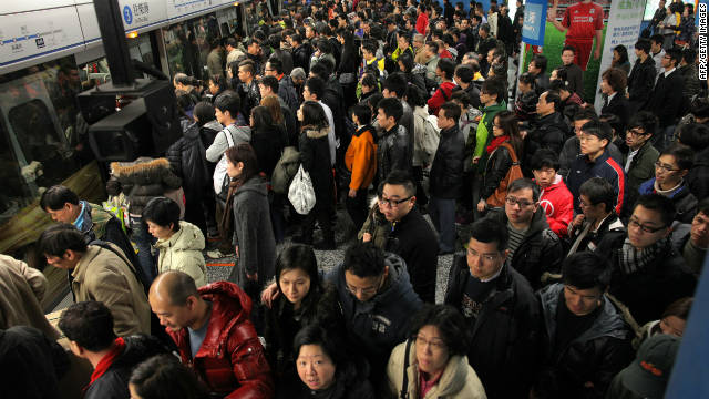 Travellers prepare to board a mass transit railway (MTR) train in Hong Kong on January 29.