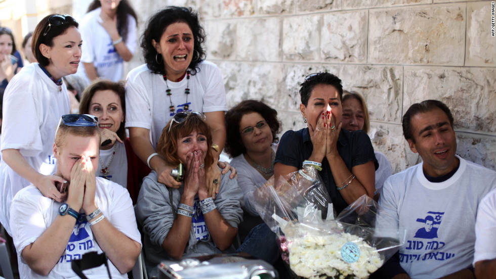 Supporters of Shalit celebrate his release at his family&#39;s protest tent outside the prime minister&#39;s residence in Jerusalem. 