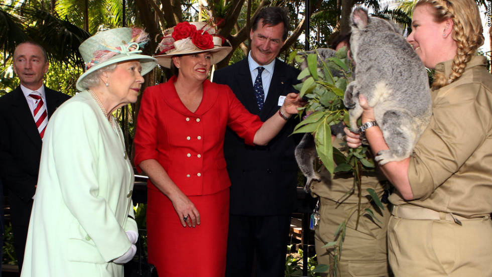 Queensland Premier Anna Bligh shows Queen Elizabeth II a koala during a visit to Rainforest Walk, Southbank, in October  2011, in Brisbane, Australia. 