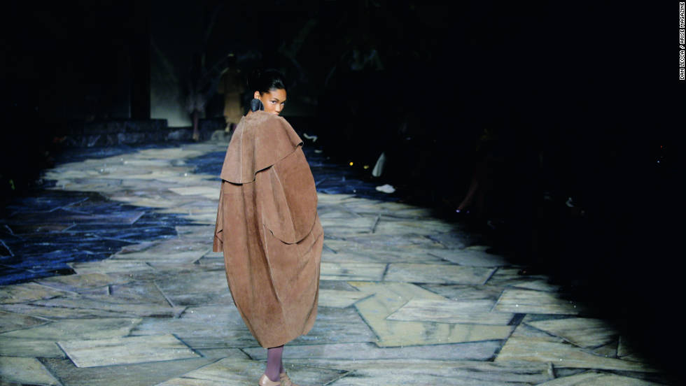 A model walks the catwalk wrapped in a coat from the Black Coffee fashion range.