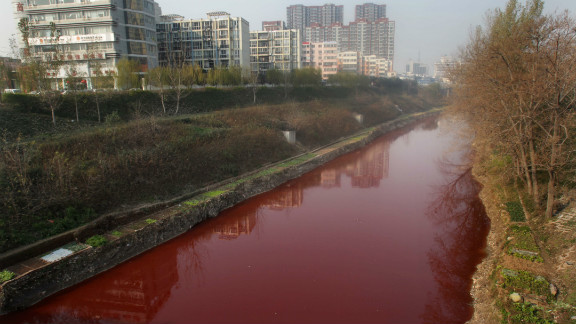 The Jian River flows red after being polluted with dye from an illegal workshop.