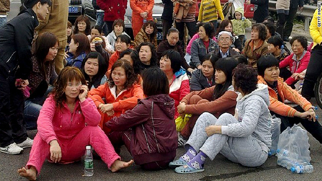 Protesters block a highway demanding the removal of a coal-fired plant from Haimen in south China  on December 20, 2011. 