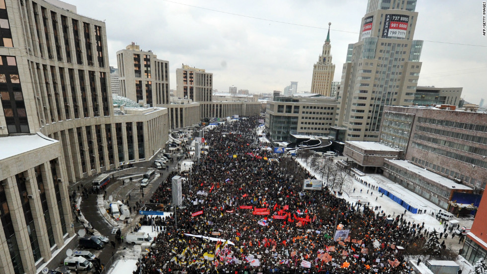 Thousands of protesters flood through Moscow streets, calling for fair elections.
