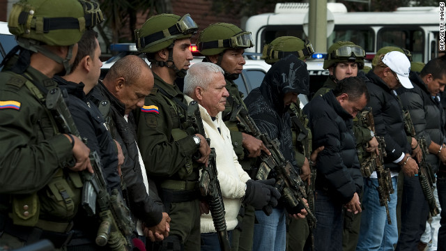 Police guard alleged members of the &#39;Loco Barrera&#39; (Crazy Barrera) drug trafficking ring. The U.S. wants them extradited.