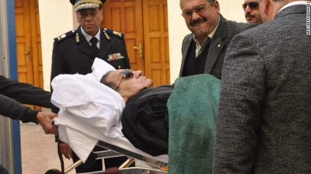 Ousted Egyptian president Hosni Mubarak is wheeled into court on a stretcher on January 3, 2012.