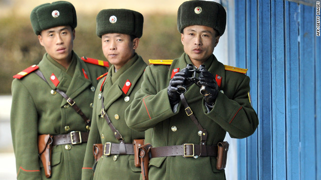 North Korean soldiers look at South Korea across the Korean Demilitarized Zone (DMZ).