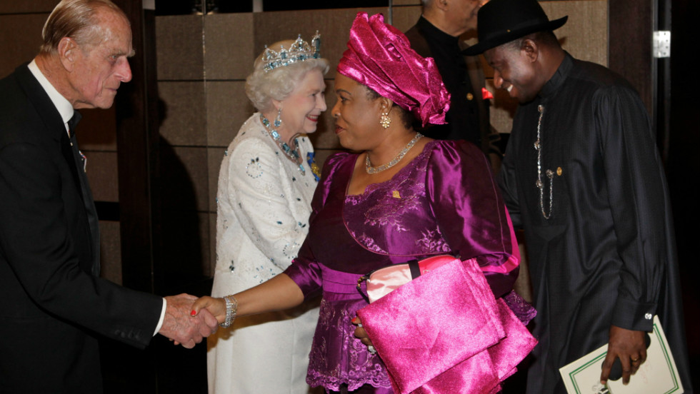 Britain&#39;s Queen Elizabeth II greets Nigerian President Goodluck Jonathan as his wife greets Prince Phillip at a banquet dinner in Perth on October 28, 2011