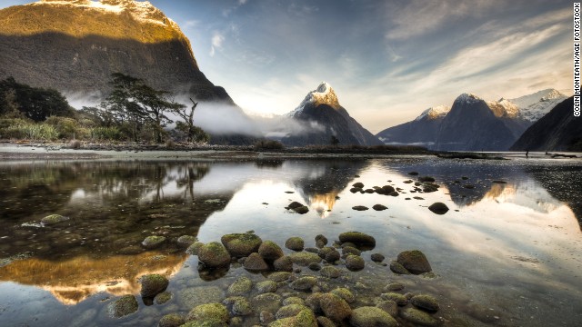 Dawn breaks during winter at Mitre Peak in Milford Sound, the most famous of the 15 fjords in Fiordland National Park.