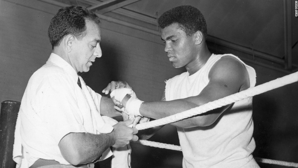 Angelo Dundee helped a young Cassius Clay transform himself into the world heavyweight champion. Here he tapes the renamed Muhammad Ali&#39;s hands at a training session ahead of a 1966 bout with British champion Henry Cooper.