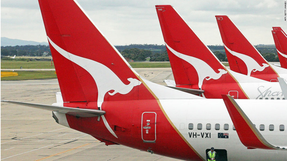 Qantas cuts jobs as profits dive - CNN