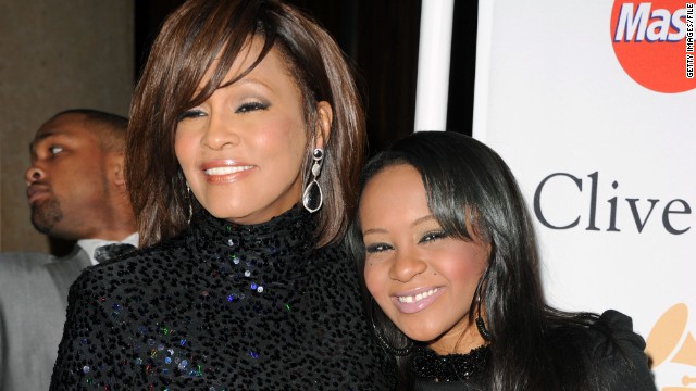 Whitney Houston, left, and Bobbi Kristina Brown arrive at a pre-Grammy event in February 2011 in Beverly Hills, California.