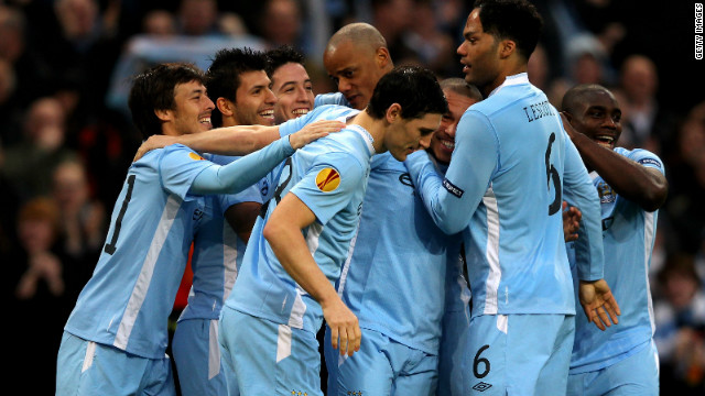 Manchester City players celebrate Sergio Aguero&#39;s opener in the 4-0 win over Porto at the Etihad Stadium