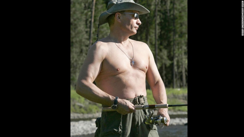 A shirtless Putin fishing in the headwaters of the Yenisei River in the Republic of Tuva on August 13, 2007.