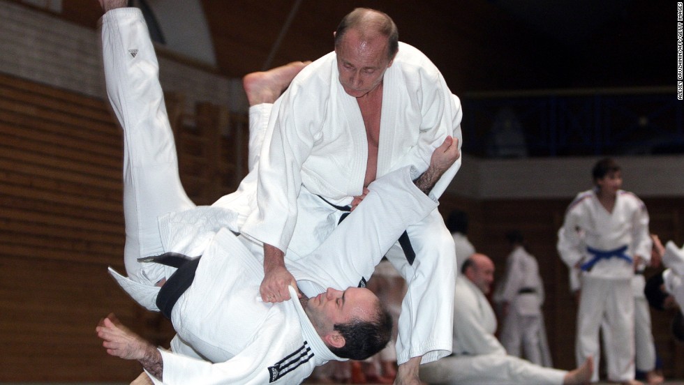 Famed for his love of martial arts, Putin throws a competitor in a judo session at an athletics school in St. Petersburg on December 18, 2009.