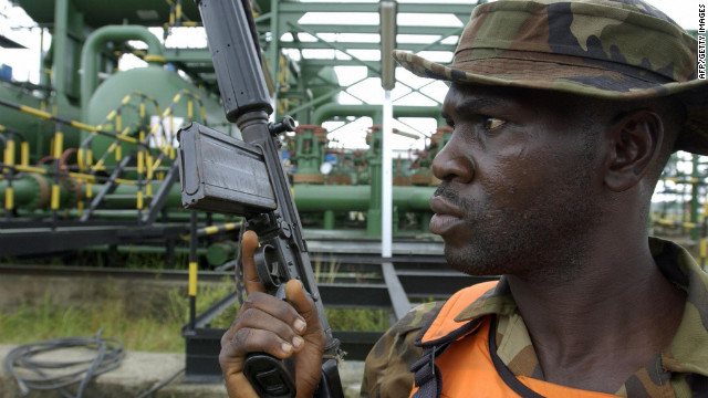 A Nigerian soldier stands guard at an oil flow station in the western Niger Delta in 2003. 