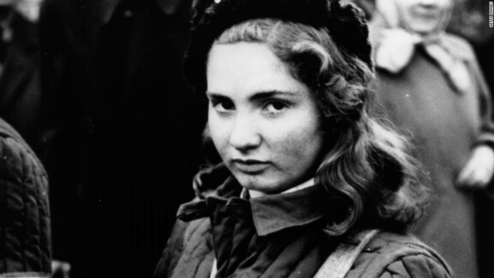 A 15-year-old Hungarian girl armed with a machine gun during protests against the country&#39;s communist rulers. 