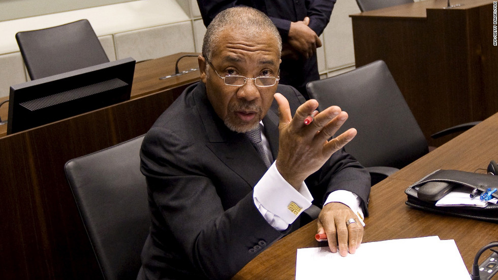 Charles Taylor waits for the start of the prosecution&#39;s closing arguments during his trial at the U.N. Special Court for Sierra Leone in February 2011.