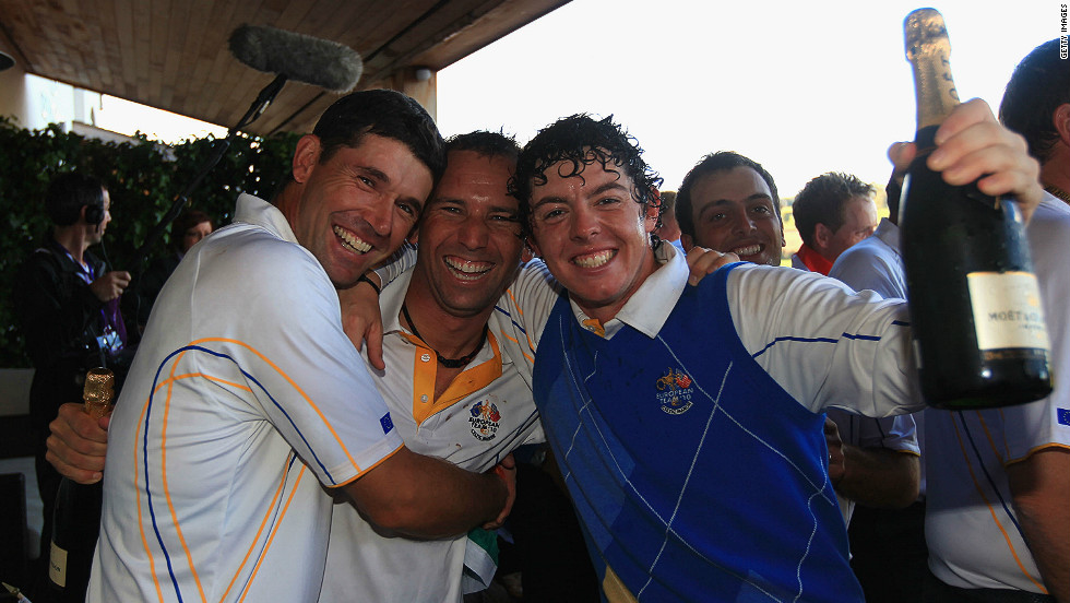 McIlroy celebrates Europe&#39;s win (by one point) over the U.S. team with teammate Padraig Harrington (left) and vice-captain, Spain&#39;s Sergio Garcia. 