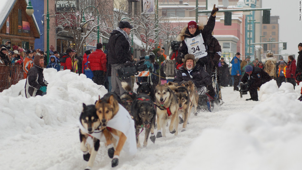 Fans cheer teams Saturday in Anchorage during the race&#39;s ceremonial start.