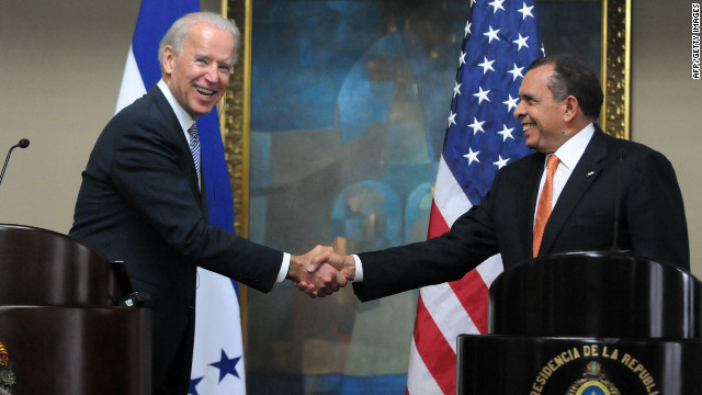 US Vice President Joe Biden, left, shakes hands with Honduran President Porfirio Lobo in Tegucigalpa on Tuesday.