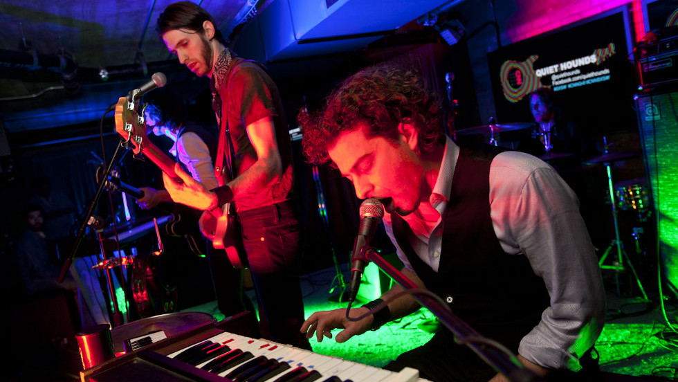 The band Quiet Hounds performs inside the CNN Grill.