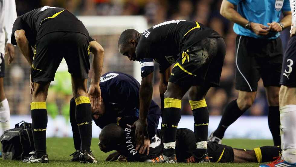 Bolton player Fabrice Muamba  lies prone on the pitch after collapsing before halftime during the English FA Cup quarterfinal away to Tottenham Hotspur on Saturday. 