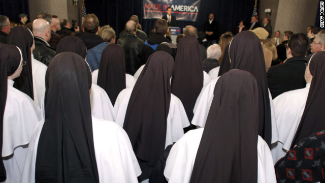 A group of Catholic nuns listens to former U.S. Sen. Rick Santorum  at a rally at a Knights of Columbus Council in Michigan.