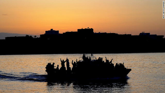 A boat carrying Tunisian migrants enters the port of Lampedusa on April 12, 2011 The island is close to North Africa. 