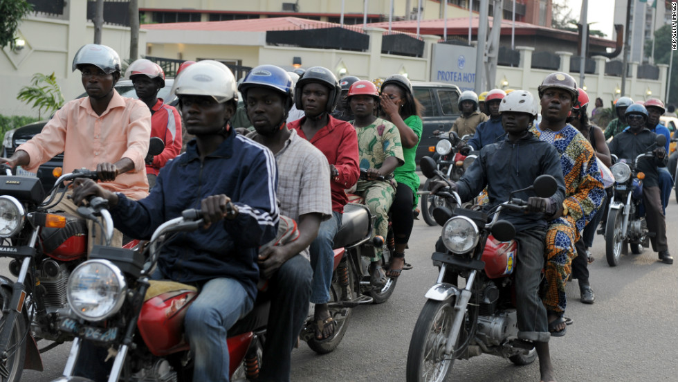 Riding a motorcycle taxi, also known as &quot;okada,&quot; is one of the ways to get around Lagos.  