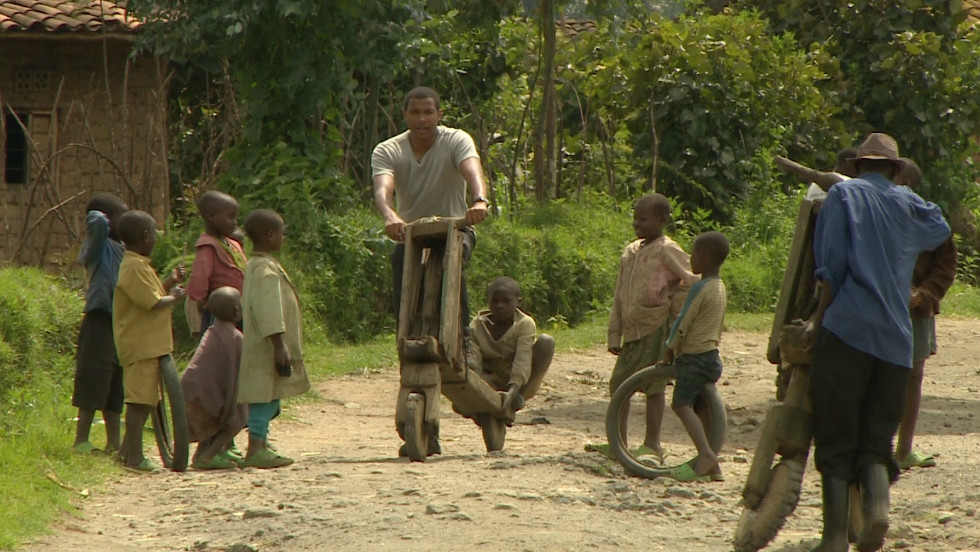 Errol Barnett trials a bike made entirely from wood, in Musanze, northern Rwanda. The bikes are so heavy and difficult to brake that they are banned from main streets.