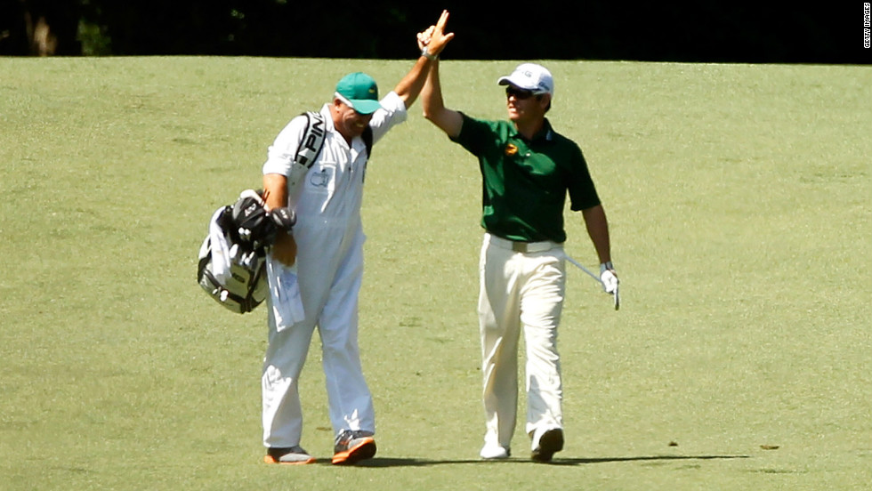 Louis Oosthuizen celebrates his double eagle from the second fairway in the final round of the Masters at  Augusta National.