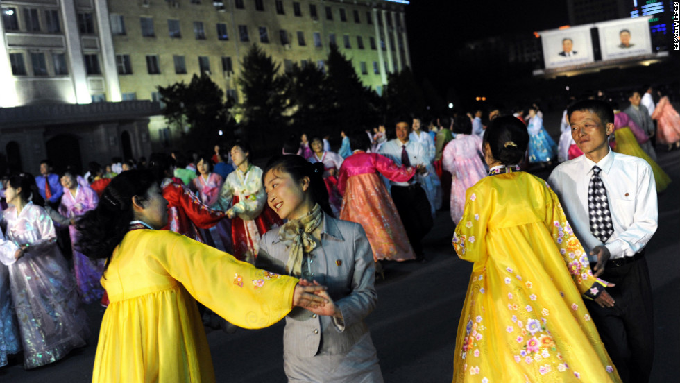 Citizens dance on Monday during a rehearsal for the commemoration of Kim Il-Sung&#39;s 100th birthday anniversary. Japan, the United States and South Korea see the launch -- which would violate U.N. Security Council resolutions -- as a cover for a long-range ballistic missile test. And a South Korean intelligence report says it&#39;s likely to precede a nuclear test, as it did in 2006 and 2009.