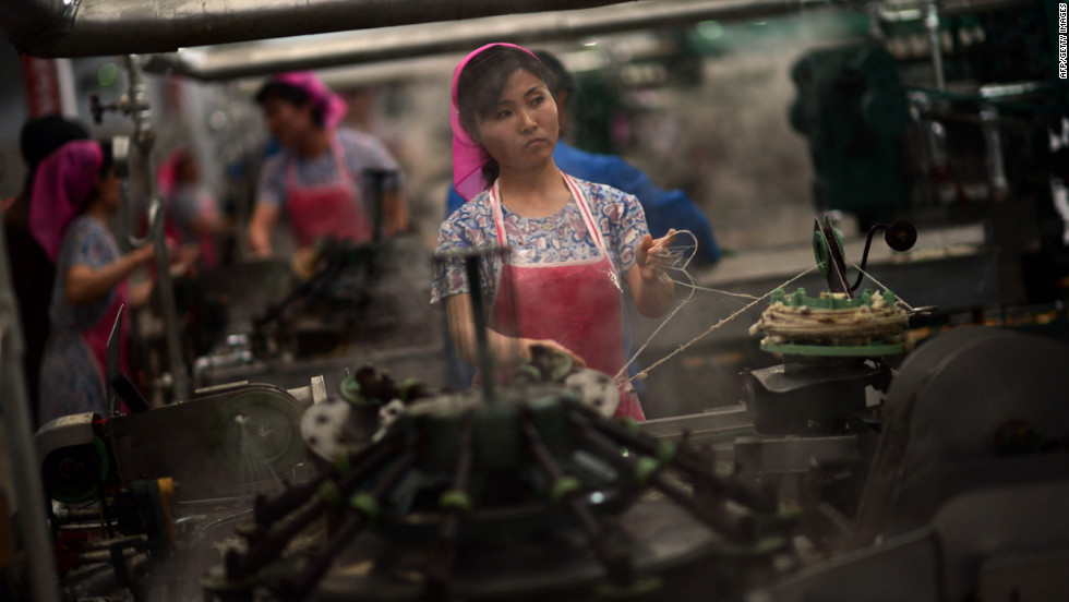 Employees work in a textile factory in Pyongyang. 