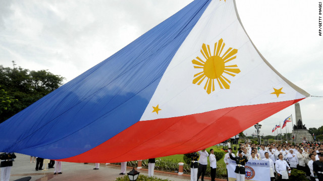 	Government officials lead a flag-raising ceremony at Manila&#39;s Luneta park on June 12, 2009, to celebrate the 111th anniversary of the declaration of Philippine independence from Spanish rule. The day was marked with job fairs and other programmes to emphasise the efforts to alleviate the effects of the world financial turmoil. AFP PHOTO / JAY DIRECTO (Photo credit should read JAY DIRECTO/AFP/Getty Images) 