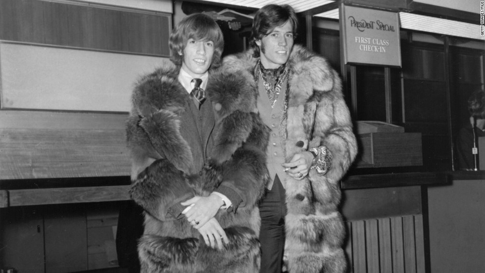 Robin Gibb, left, and brother Barry at London&#39;s Heathrow Airport in 1967. 