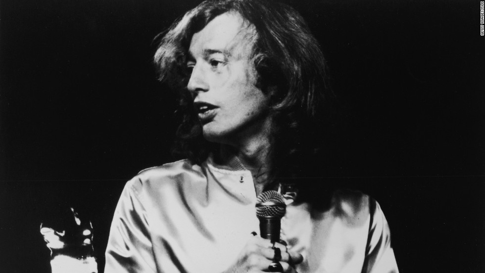 Robin Gibb sings on stage during a concert in London in 1975.