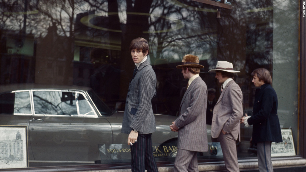 The Bee Gees, formerly known as The Brothers Gibb, pose in front of a Rolls Royce showroom in 1967.